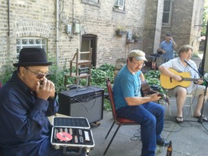 Johnny Drummer, Paul Kaye, and Jerry Zybach play together in the backyard